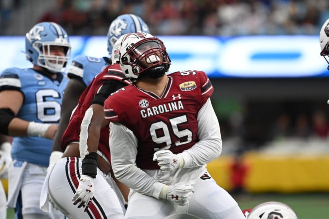 South Carolina defensive lineman Alex Huntley celebrates one of the Gamecocks’ four sacks of North Carolina quarterback Sam Howell in the Duke’s Mayo Bowl on Thursday at Bank of America Stadium.