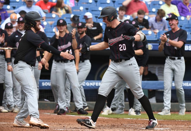 South Carolina batter Ethan Petry is congratulated by teammates after hitting a home run against LSU during the second round of the SEC Baseball Tournament at the Hoover Met Wednesday, May 24, 2023.