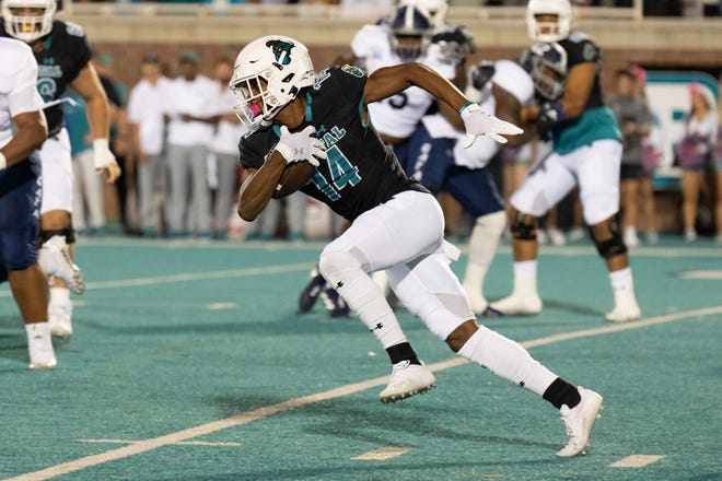 Oct 1, 2022; Conway, South Carolina, USA; Coastal Carolina Chanticleers wide receiver Jared Brown (14) runs he ball in the first quarter against the Georgia Southern Eagles at Brooks Stadium. Mandatory Credit: David Yeazell-USA TODAY Sports