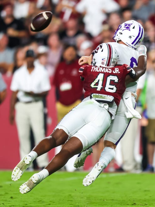 Sep 9, 2023; Columbia, South Carolina, USA; South Carolina Gamecocks defensive end Bryan Thomas Jr. (46) hits Furman Paladins quarterback Tyler Huff (6) as he throws during the second quarter at Williams-Brice Stadium. Mandatory Credit: Jeff Blake-USA TODAY Sports