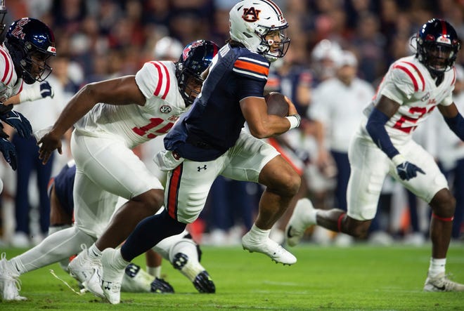 Auburn Tigers quarterback Robby Ashford (9) runs the ball as Auburn Tigers take on Mississippi Rebels at Jordan-Hare Stadium in Auburn, Ala., on Saturday, Oct. 21, 2023. Mississippi Rebels defeated Auburn Tigers 28-21.