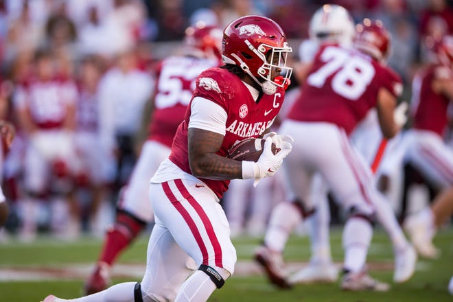 Nov 11, 2023; Fayetteville, Arkansas, USA; Arkansas Razorbacks running back Raheim Sanders (5) runs the ball during the first quarter against the Auburn Tigers at Donald W. Reynolds Razorback Stadium. Mandatory Credit: Brett Rojo-USA TODAY Sports