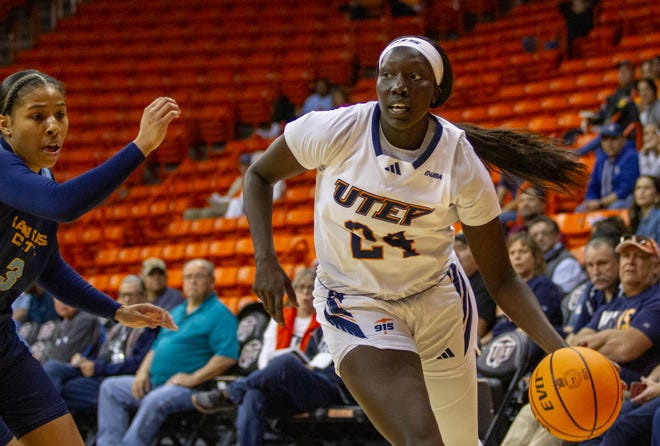 UTEP's Adhel Tac (24) dribbles past a UMKC defender at the Don Haskins center on Nov. 11, 2023.