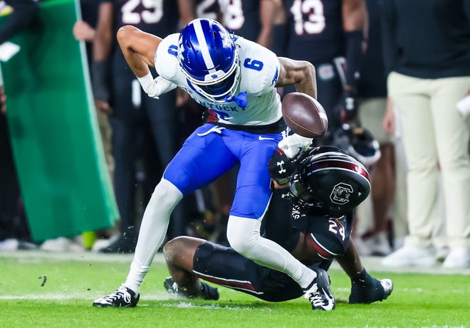 Nov 18, 2023; Columbia, South Carolina, USA; Kentucky Wildcats wide receiver Dane Key (6) fumbles as he is hit by South Carolina Gamecocks defensive back Jalon Kilgore (24) in the second quarter at Williams-Brice Stadium. Mandatory Credit: Jeff Blake-USA TODAY Sports Kentucky