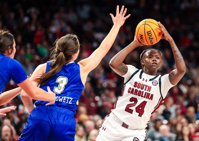 Nov 20, 2023; Columbia, South Carolina, USA; South Carolina Gamecocks forward Sahnya Jah (24) looks to pass around South Dakota State Jackrabbits guard Madison Mathiowetz (3) in the second half at Colonial Life Arena. Mandatory Credit: Jeff Blake-USA TODAY Sports