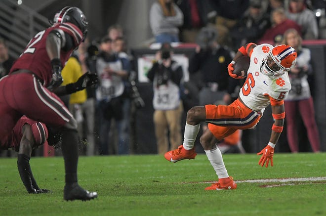 Clemson receiver Tyler Brown (6) catches a pass near South Carolina edge Jatius Geer (12) during the second quarter Nov 25, 2023; Columbia, South Carolina, USA; at Williams-Brice Stadium.