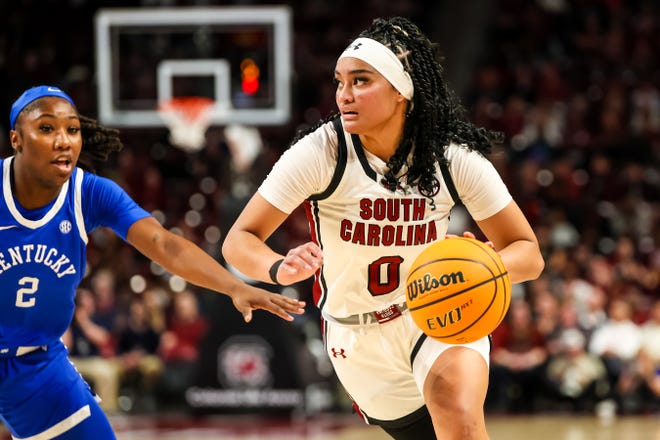 Jan 15, 2024; Columbia, South Carolina, USA; South Carolina Gamecocks guard Te-Hina Paopao (0) drives around Kentucky Wildcats guard Saniah Tyler (2) in the first half at Colonial Life Arena. Mandatory Credit: Jeff Blake-USA TODAY Sports