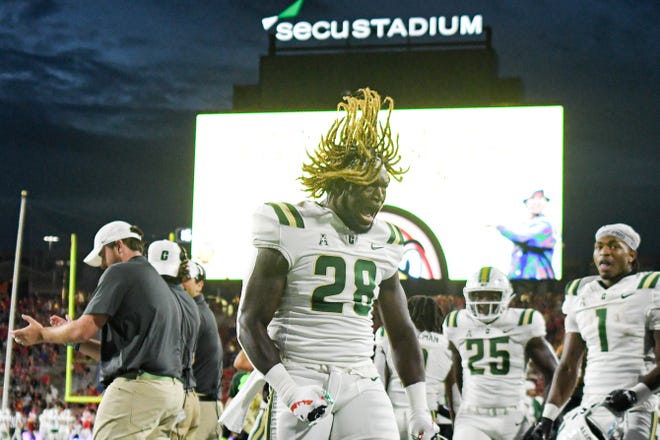 Sep 9, 2023; College Park, Maryland, USA; Charlotte 49ers linebacker Demetrius Knight II (28) reacts after returning a interception for a touchdown against the Maryland Terrapins at SECU Stadium. Mandatory Credit: Tommy Gilligan-USA TODAY Sports