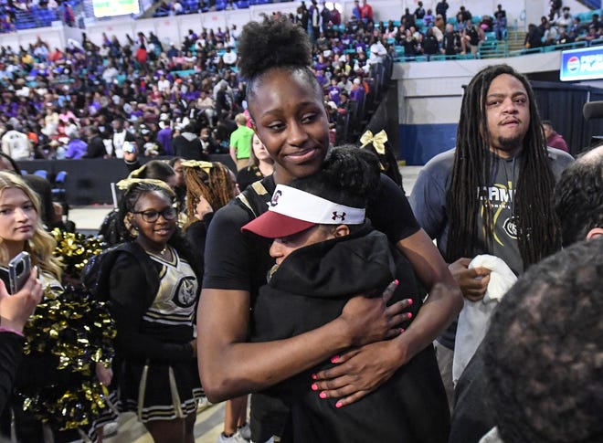 Dawn Staley, Head coach of the University of South Carolina basketball team, hugs Gamecocks signee Joyce Edwards of Camden High, after they won 44-22 against Wren High in the 2024 South Carolina High School 3A Basketball Championship game at the Florence Center in Florence, S.C. Saturday, March 2, 2024.