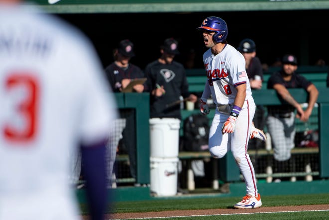 Clemson senior Blake Wright(8) celebrates as he runs to home plate after hitting a home run during the bottom of the ninth inning at Doug Kingsmore Stadium in Clemson Sunday, March 3, 2024.