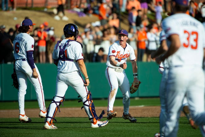 Clemson sophomore Nolan Nawrocki (2), senior Jimmy Obertop (11) and Clemson senior Jacob Hinderleider (6) celebrate after a 5-4 win over South Carolina at Doug Kingsmore Stadium in Clemson Sunday, March 3, 2024.