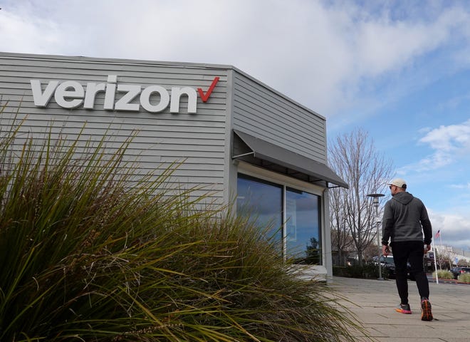 A person walks by a Verizon store on January 23, 2024 in Corte Madera, California.