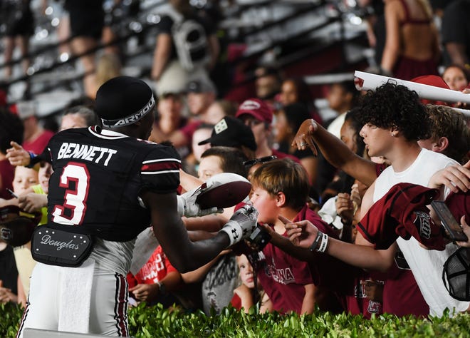 The University of South Carolina Spring football game took place at William-Brice Stadium on April 24, 2024. USC's Mazeo Bennett (3) from Greenville High greets fans on the sidelines.