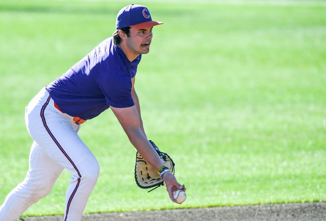 Clemson first baseman Jimmy Obertop tosses a ball in a drill during practice at Doug Kingsmore Stadium in Clemson, S.C. Tuesday, February 13, 2024.