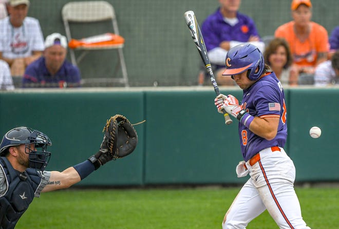 Clemson senior Blake Wright (8) is hit by a Georgia Tech pitch during the second game at Doug Kingsmore Stadium in Clemson Friday, May 3, 2024.