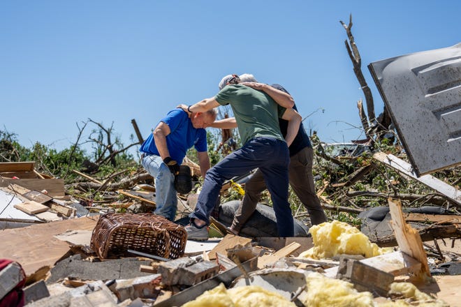 May 7, 2024: Billy Moles (L) is prayed for after his home was destroyed last night by a tornado in Barnsdall, Oklahoma. Barnsdall, a small town with approximately 1,000 people, was struck last night by an EF3 tornado. This latest destruction comes just one week after Oklahoma has been hit with a slew of deadly tornados.