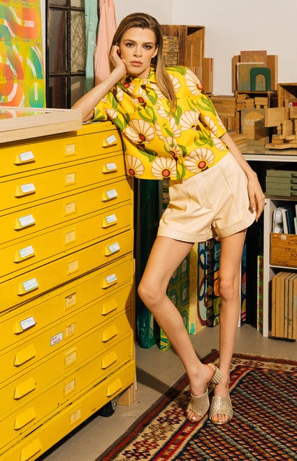 Thadea Top in Yellow by Tara Jarmon, $385 at Coleman Collection; Chace Vegan Leather Shorts in Ecru by Simkhai, $365 at Monkees of the West End; Dorica Upcycle Mule in Silver Golden by AGL, $525 at Monkees of the West End 

Studio of Sunny McGowan