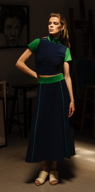 Julie Skirt in Navy and Kelly Green by De Loreta, $240 at Monkees of the West End; Tusuy Top in Navy and Kelly Green by De Loreta, $156 at Monkees of the West End; Osha Pillow Heel in Ivory by 4CCCCEES, $325 at Monkees of the West End 

Studio of Tim Speaker