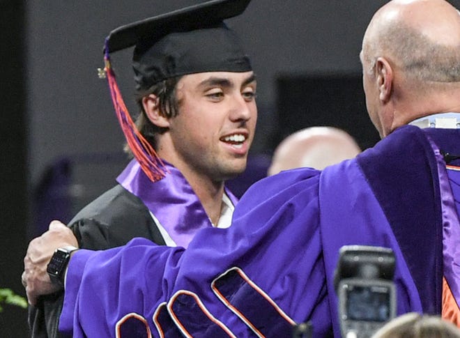 Blake Wright, a student-athlete baseball player with a B.S. in Economics, shakes hands with President Jim Clements during one of Clemson University's Spring Commencement ceremonies, at Littlejohn Coliseum in Clemson, S.C. Thursday, May 9, 2024. The school had a record number 104 student-athletes graduate this Spring, stated in a press release by the University.