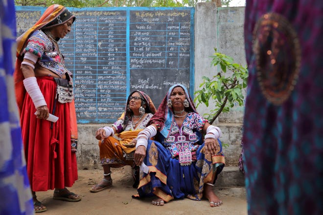 May 13, 2024: Women sit as they wait to cast their votes at a polling station during the fourth phase of India's general election in Rangareddy district in the southern state of Telangana.