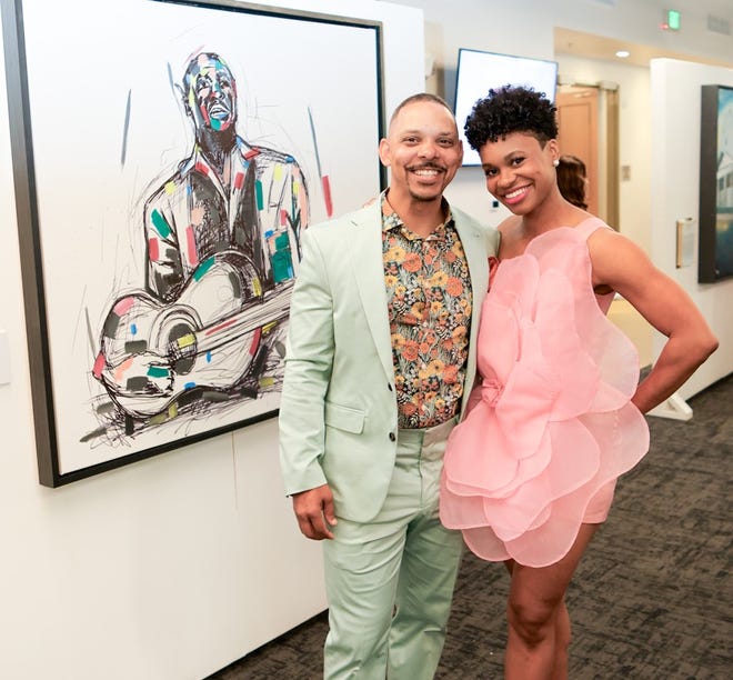 Timmothy Cunningham, Marissa Cunningham at Greenville Through a Lens, a Fine Arts Exhibit & Cultural Event hosted by The Cunningham Fine Arts Foundation. The event at The Unity Park’s Prisma Health Welcome Center, offered a one of a kind opportunity to experience some of Greenville's Black history on canvas and in performance, including original artwork from artist Timothy Cunningham.