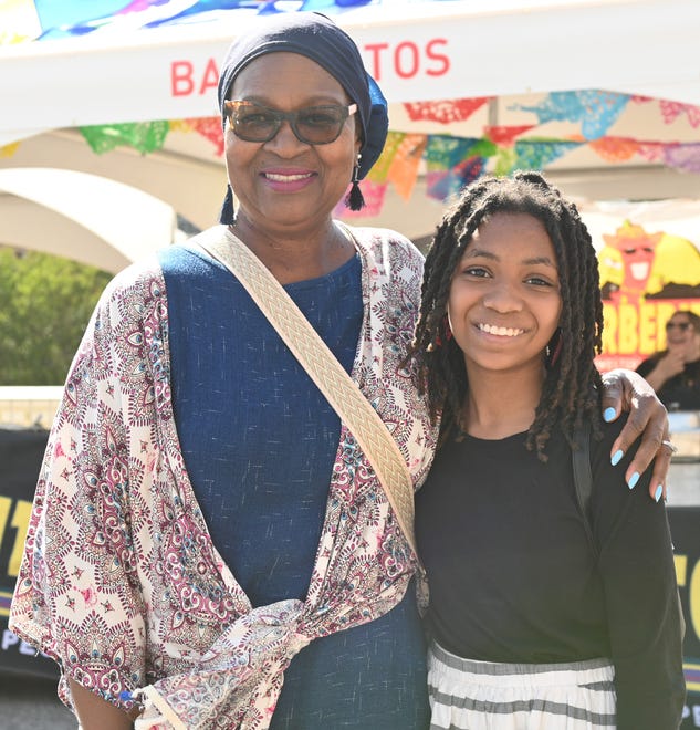 Sunnie Joiner, Aaliyah Shannon at the unveiling of the sculpture “Tandem Lovers,” created by Australian artists Gillie and Marc Schattner, was presented to the City of Greenville as a gift from the Artisphere festival. The downtown arts extravaganza is celebrating its 20th anniversary in 2024. This is the fifth work that the festival has given to the city.