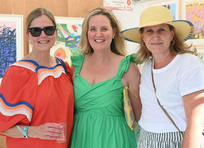 Tracey Waldrop, Lauren Batson, Amanda Schulte at the unveiling of the sculpture “Tandem Lovers,” created by Australian artists Gillie and Marc Schattner, was presented to the City of Greenville as a gift from the Artisphere festival. The downtown arts extravaganza is celebrating its 20th anniversary in 2024. This is the fifth work that the festival has given to the city.