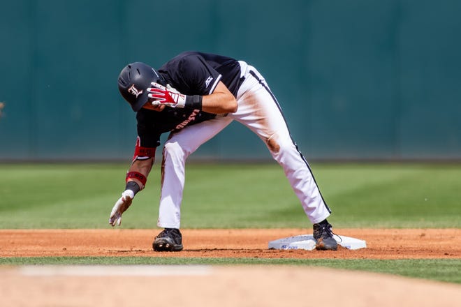 May 24, 2024; Charlotte, NC, USA; Louisville Cardinals infielder Gavin Kilen (5) celebrates a double in the second inning against the Clemson Tigers during the ACC Baseball Tournament at Truist Field. Mandatory Credit: Scott Kinser-USA TODAY Sports