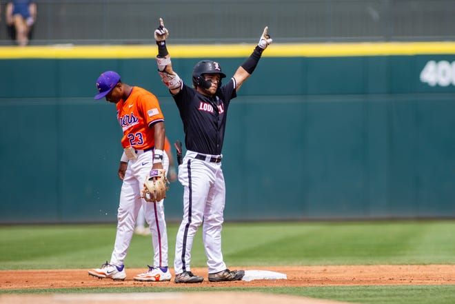 May 24, 2024; Charlotte, NC, USA; Louisville Cardinals infielder Dylan Hoy (9) celebrates a double in the second inning against the Clemson Tigers during the ACC Baseball Tournament at Truist Field. Mandatory Credit: Scott Kinser-USA TODAY Sports