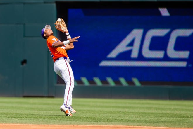 May 24, 2024; Charlotte, NC, USA; Clemson Tigers infielder Jarren Purify (23) makes the catch for an out in the second inning against the Louisville Cardinals during the ACC Baseball Tournament at Truist Field. Mandatory Credit: Scott Kinser-USA TODAY Sports