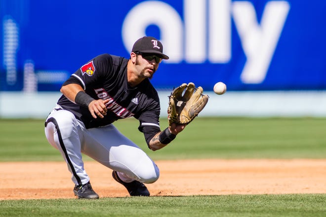 May 24, 2024; Charlotte, NC, USA; Louisville Cardinals infielder Logan Beard (2) fields a ground ball in the third inning against the Clemson Tigers during the ACC Baseball Tournament at Truist Field. Mandatory Credit: Scott Kinser-USA TODAY Sports