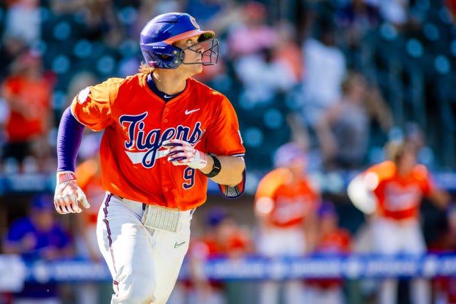 May 24, 2024; Charlotte, NC, USA; Clemson Tigers catcher Jacob Jarrell (9) hits a homer in the sixth inning against the Louisville Cardinals during the ACC Baseball Tournament at Truist Field. Mandatory Credit: Scott Kinser-USA TODAY Sports