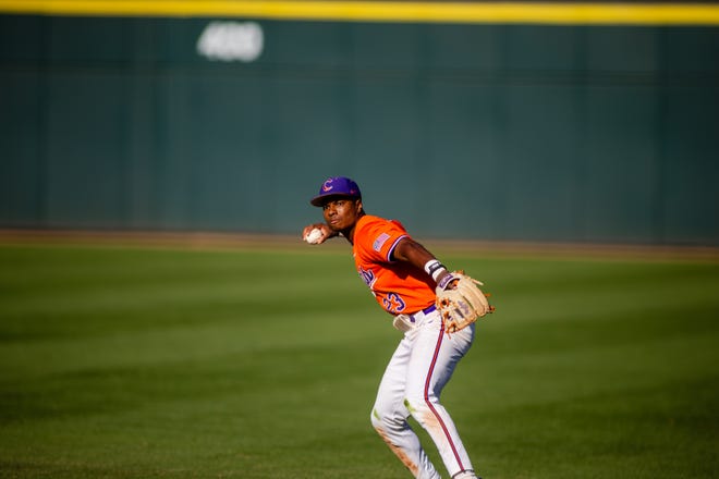 May 24, 2024; Charlotte, NC, USA; Clemson Tigers infielder Jarren Purify (23) throws to first for an out in the seventh inning against the Louisville Cardinals during the ACC Baseball Tournament at Truist Field. Mandatory Credit: Scott Kinser-USA TODAY Sports