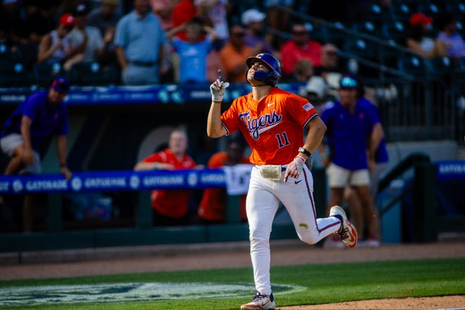 May 24, 2024; Charlotte, NC, USA; Clemson Tigers utility Jimmy Obertop (11) celebrates a three run homer against the Louisville Cardinals in the seventh inning during the ACC Baseball Tournament at Truist Field. Mandatory Credit: Scott Kinser-USA TODAY Sports