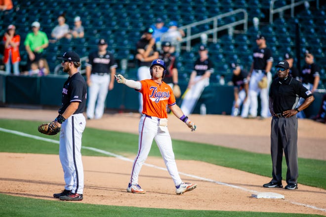 May 24, 2024; Charlotte, NC, USA; Clemson Tigers infielder Blake Wright (8) celebrates a single in the ninth inning against the Louisville Cardinals during the ACC Baseball Tournament at Truist Field. Mandatory Credit: Scott Kinser-USA TODAY Sports