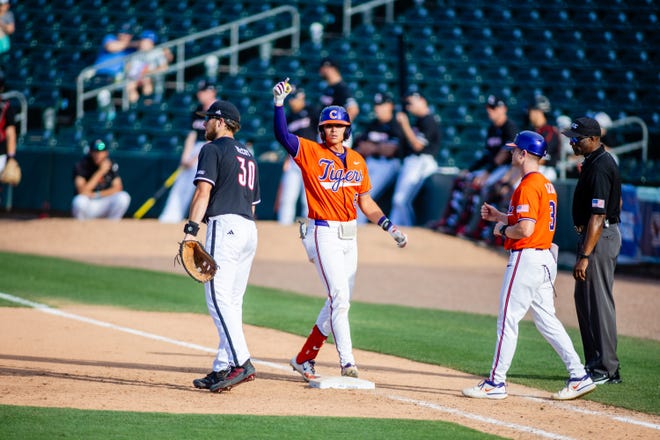 May 24, 2024; Charlotte, NC, USA; Clemson Tigers infielder Jacob Hinderleider (6) celebrates a single in the ninth inning against the Louisville Cardinals during the ACC Baseball Tournament at Truist Field. Mandatory Credit: Scott Kinser-USA TODAY Sports