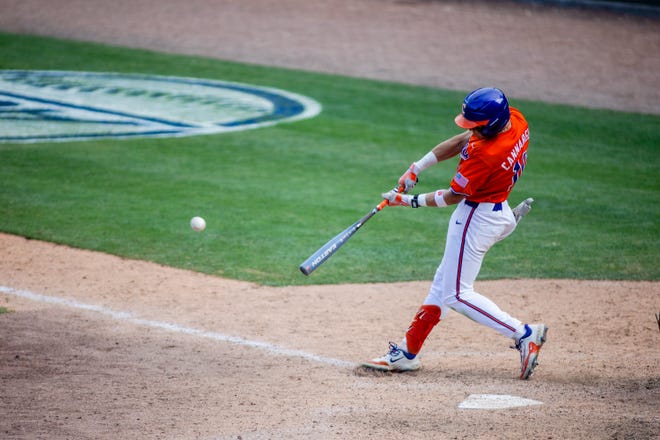 May 24, 2024; Charlotte, NC, USA; Clemson Tigers outfielder Cam Cannarella (10) singles in the ninth inning against the Louisville Cardinals during the ACC Baseball Tournament at Truist Field. Mandatory Credit: Scott Kinser-USA TODAY Sports