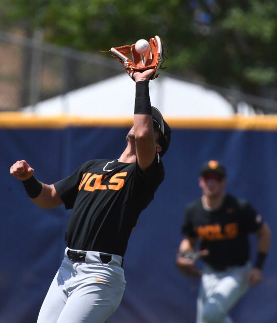 May 26 2024; Hoover, AL, USA; Tennessee shortstop Dean Curley (23) snags a fly ball in shallow left field against LSU at the Hoover Met during the championship game of the SEC Tournament.