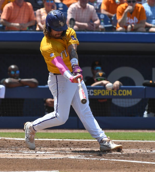 May 26 2024; Hoover, AL, USA; LSU batter Tommy White (47) connects with a pitch against Tennessee at the Hoover Met during the championship game of the SEC Tournament.