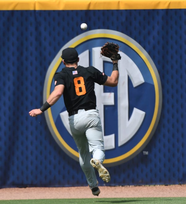 May 26 2024; Hoover, AL, USA; Tennessee outfielder Dylan Dreiling (8) chases a double by LSU batter Tommy White (47) at the Hoover Met during the championship game of the SEC Tournament.