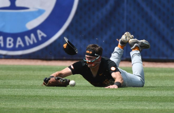 May 26 2024; Hoover, AL, USA; Tennessee outfielder Dylan Dreiling (8) makes a diving try but can’t come up with an LSU hit at the Hoover Met during the championship game of the SEC Tournament.