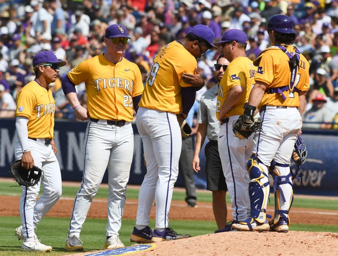 May 26 2024; Hoover, AL, USA; LSU pitcher Christian Little touches his arm where he has pain after throws a pitch against Tennessee at the Hoover Met during the championship game of the SEC Tournament.