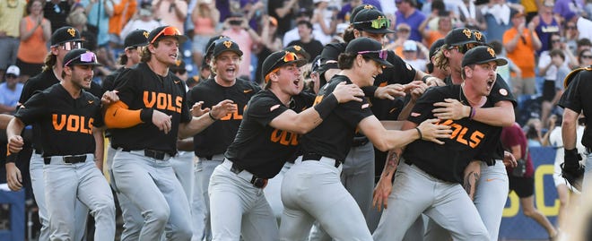 May 26 2024; Hoover, AL, USA; Tennessee players swarm relief pitcher Aaron Combs after he closed out the game with LSU at the Hoover Met to win the SEC Tournament championship game. Tennessee held on to win 4-3.