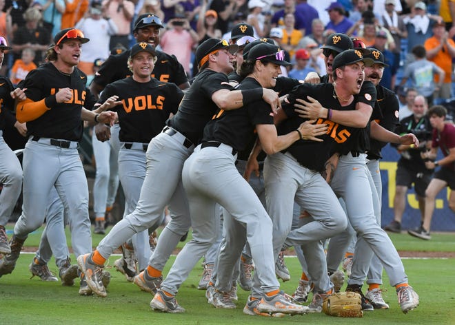 May 26 2024; Hoover, AL, USA; Tennessee players swarm relief pitcher Aaron Combs after he closed out the game with LSU at the Hoover Met to win the SEC Tournament championship game. Tennessee held on to win 4-3.