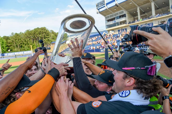 May 26 2024; Hoover, AL, USA; Tennessee player celebrate with the SEC Tournament Championship Trophy at the Hoover Met. Tennessee held on to win 4-3.