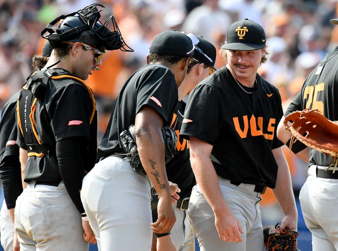 May 26 2024; Hoover, AL, USA; Tennessee pitcher Dylan Loy smiles at teammates as he is taken out of the game against LSU at the Hoover Met during the championship game of the SEC Tournament. Tennessee held on to win 4-3.