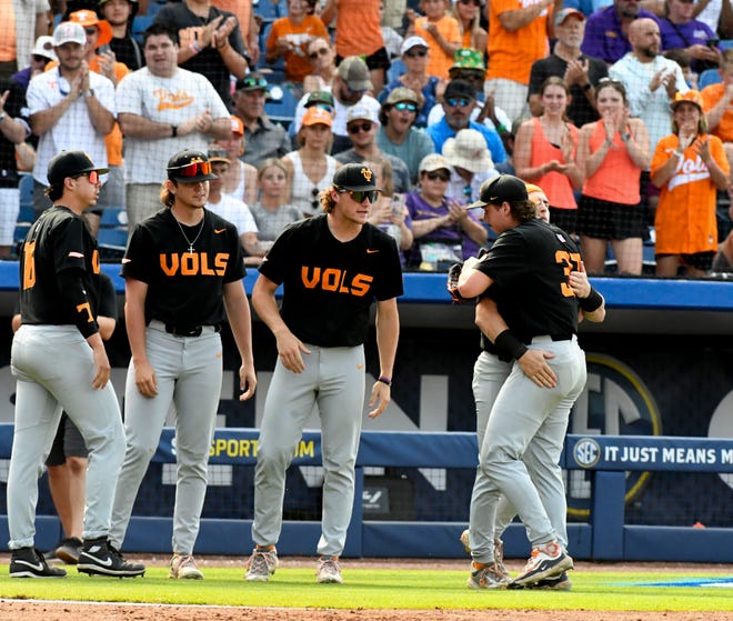 May 26 2024; Hoover, AL, USA; Tennessee pitcher Dylan Loy is greeted by teammates after he is pulled form the game with LSU at the Hoover Met during the championship game of the SEC Tournament. Tennessee held on to win 4-3.