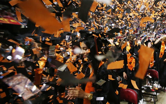 May 26, 2024 : Ames High graduates celebrate after receiving their diplomas during the class of 2024 graduation ceremony at Hilton Coliseum in Ames, Iowa.