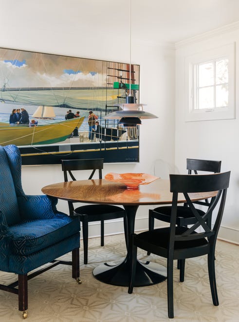 The dining room wall was bumped out four feed to accommodate a Knoll dining table the couple owned.