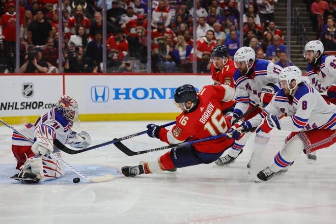 May 28, 2024; Sunrise, Florida, USA; Florida Panthers center Aleksander Barkov (16) shoots the puck against New York Rangers goaltender Igor Shesterkin (31) during overtime in game four of the Eastern Conference Final of the 2024 Stanley Cup Playoffs at Amerant Bank Arena. Mandatory Credit: Sam Navarro-USA TODAY Sports